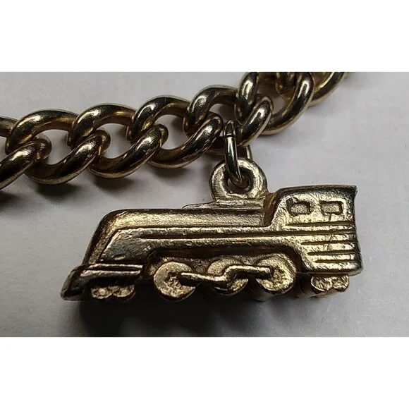 Vintage Gold Tone Charm Bracelet Airplane Cruise Ship Train Engine Florida Cross - Picture 8 of 13